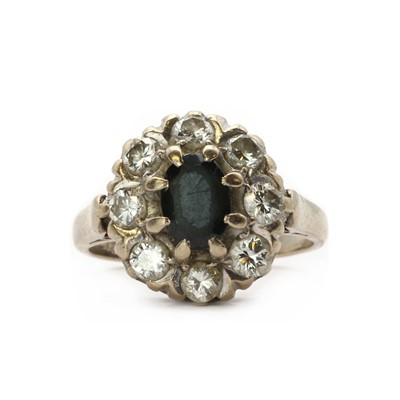 Lot 188 - A white gold sapphire and diamond cluster ring