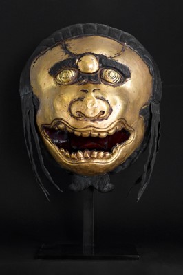 Lot 146 - A gilt-copper repoussé snow lion mask