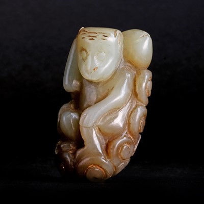 Lot 142 - A Chinese pale green jade toggle