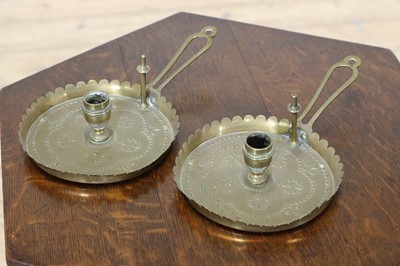 Lot 93 - A pair of Arts and Crafts candlesticks