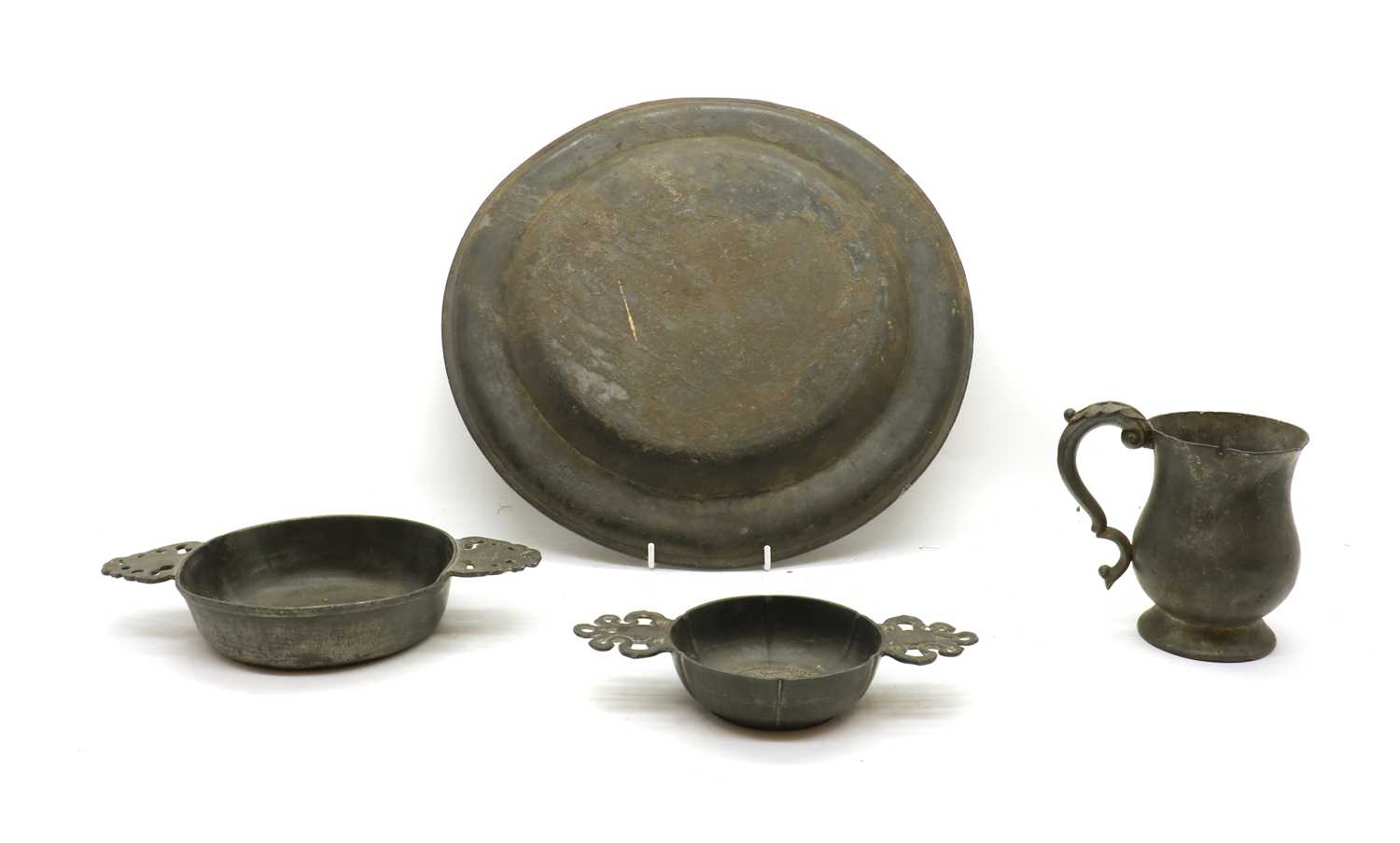 Lot 312 A collection of pewter items