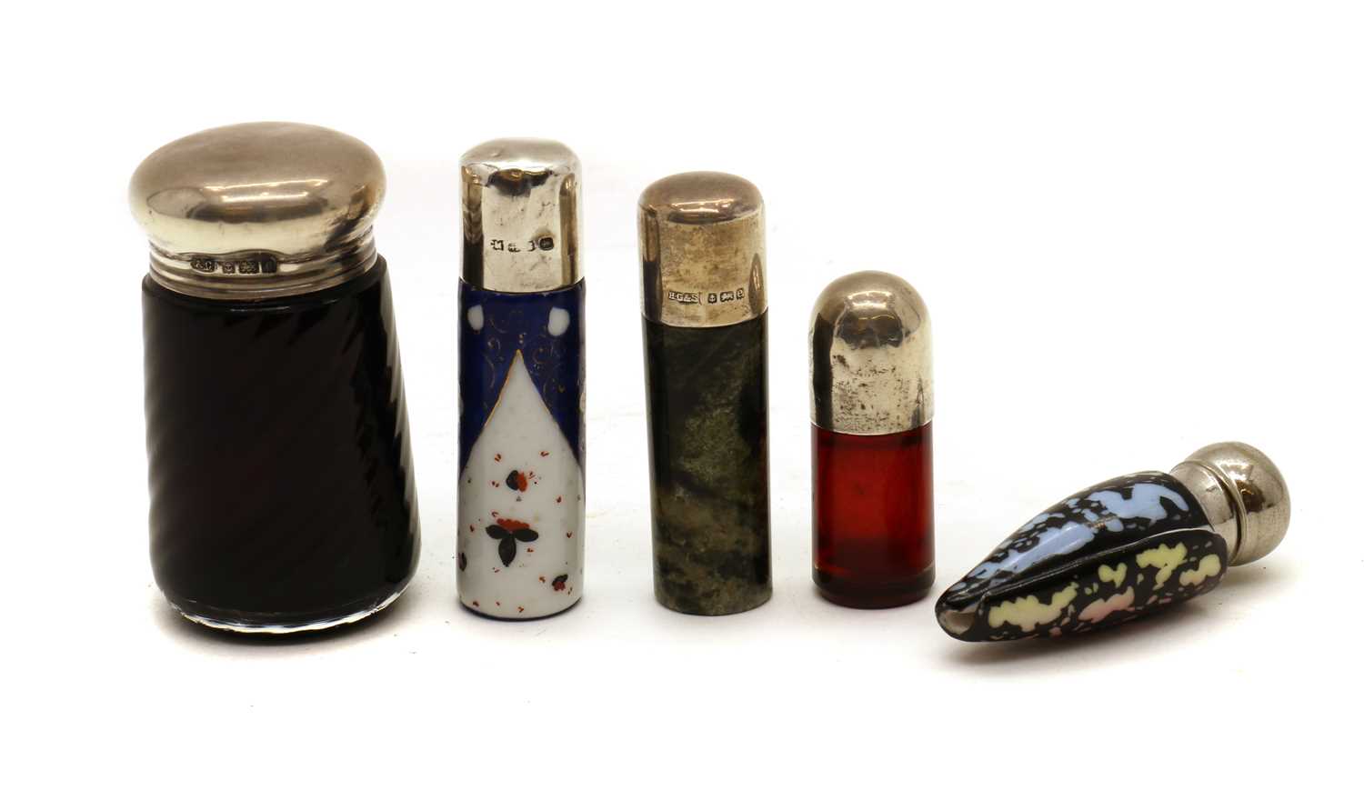 Lot 58 - A collection of silver topped scent bottles