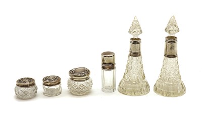 Lot 12 - A collection of silver mounted cut glass dressing table bottles