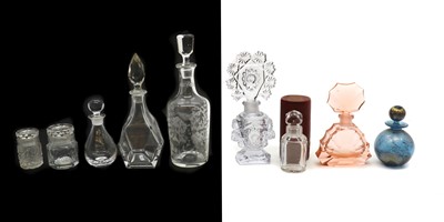 Lot 255 - A collection of cut glass perfume bottles and decanters