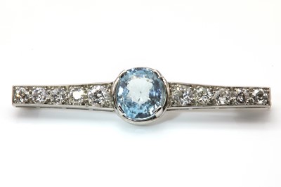 Lot 130 - A French Art Deco aquamarine and diamond graduated bar brooch