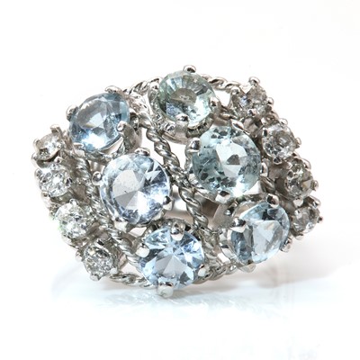 Lot 131 - An aquamarine and diamond bombé style cluster ring, c.1950