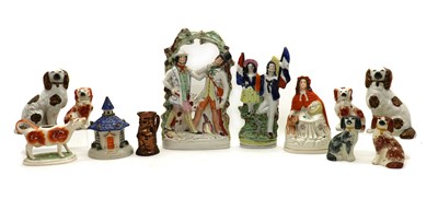 Lot 242 - A collection of Staffordshire figures