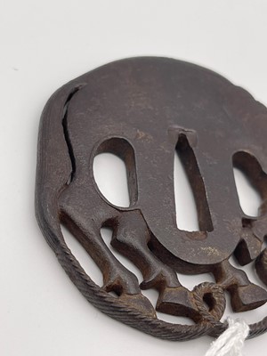 Lot 130 - An iron tsuba