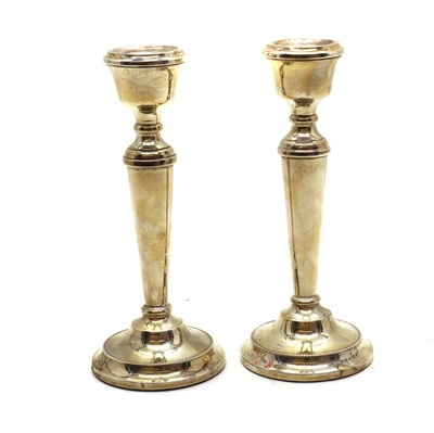 Lot 15 - A pair of silver candlesticks