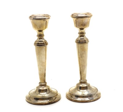 Lot 15 - A pair of silver candlesticks