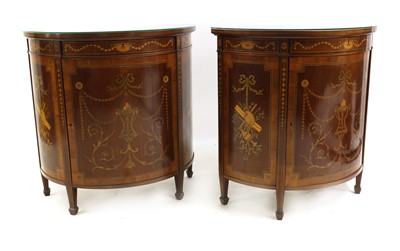 Lot 586 - A pair of Sheraton Revival satinwood and inlaid demi lune cabinets