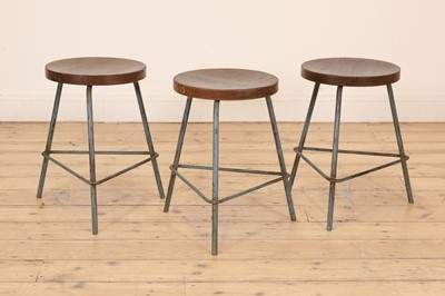 Lot 287 - A set of three teak and metal stools