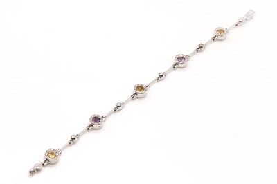 Lot 305 - An Italian 18ct white gold amethyst, citrine and diamond line bracelet