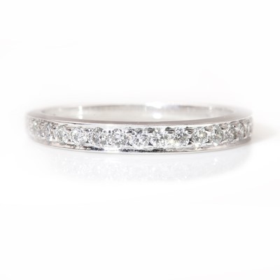 Lot 366 - An 18ct white gold diamond set half eternity ring, by Cassandra Goad, c.2002