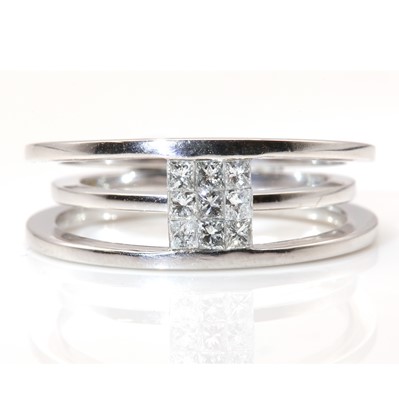 Lot 361 - An 18ct white gold diamond set contemporary band ring