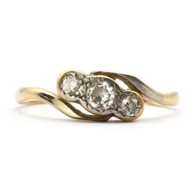 Lot 66 - A gold three stone diamond ring