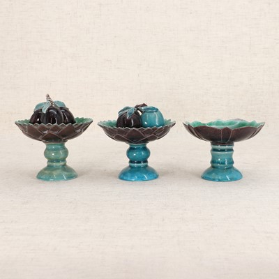 Lot 60 - Three Chinese turquoise and aubergine-glazed stem cups