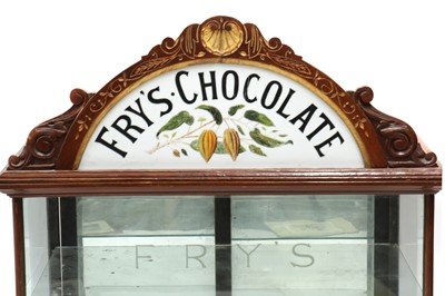 Lot 373 - A Fry’s Chocolate walnut display cabinet