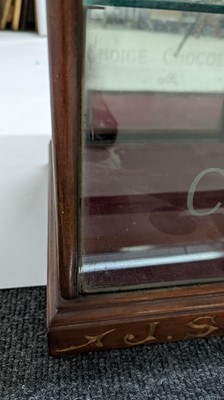 Lot 373 - A Fry’s Chocolate walnut display cabinet