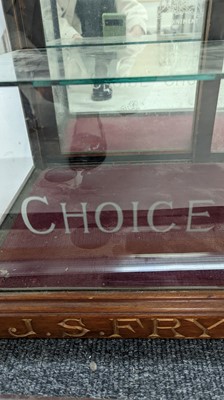 Lot 373 - A Fry’s Chocolate walnut display cabinet