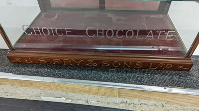Lot 373 - A Fry’s Chocolate walnut display cabinet