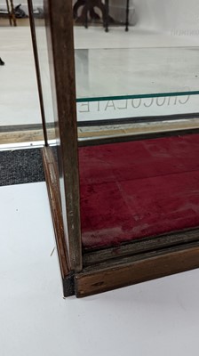 Lot 373 - A Fry’s Chocolate walnut display cabinet