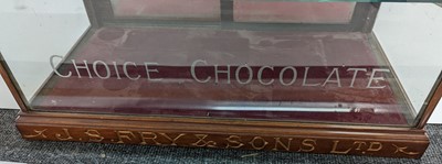 Lot 373 - A Fry’s Chocolate walnut display cabinet