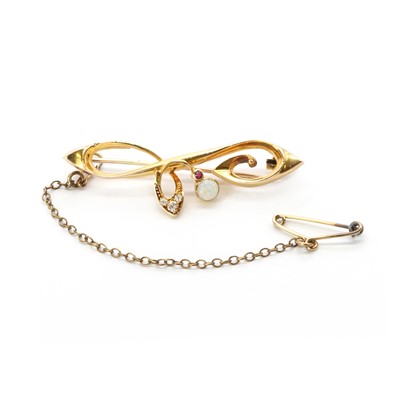 Lot 22 - An Art Nouveau gold opal, ruby and diamond brooch