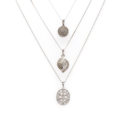 Lot 95 - Three silver diamond set pendants