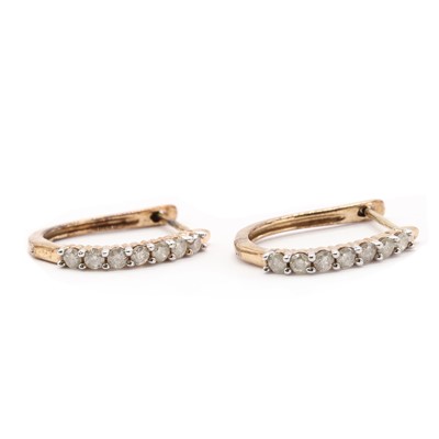 Lot 58 - A pair of 9ct gold diamond half hoop earrings