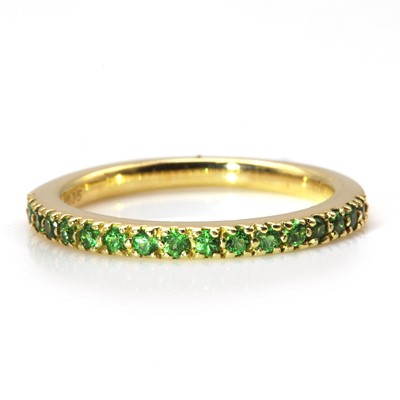 Lot 220 - A gold tsavorite garnet half eternity ring