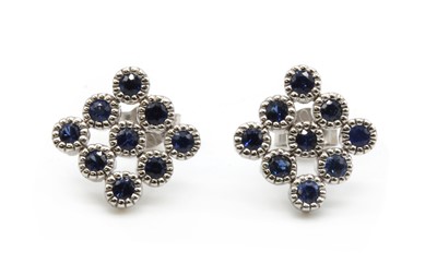 Lot 157 - A pair of white gold sapphire earrings