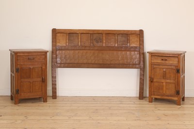 Lot 124 - A pair of Yorkshire School oak bedside tables and headboard