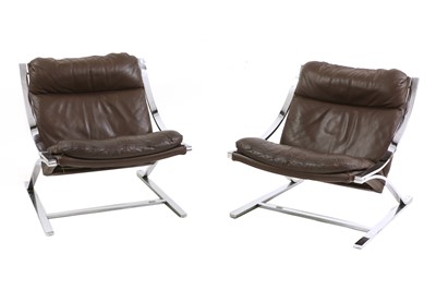 Lot 488 - A pair of 'Zeta' steel and tan leather lounge chairs