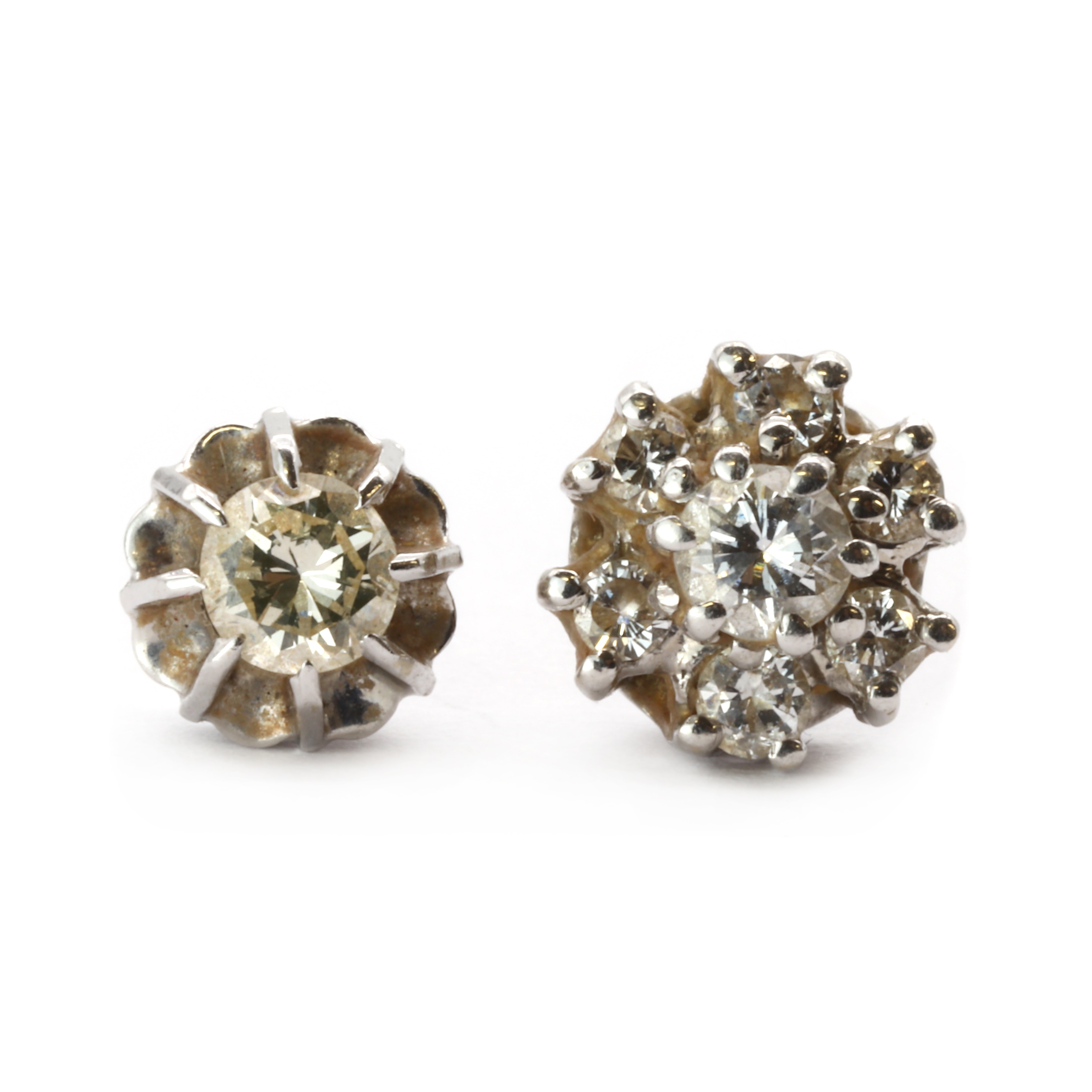 Lot 60 Two gold single diamond stud earrings,