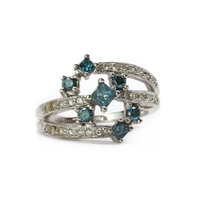 Lot 82 - A white gold diamond and treated blue diamond ring