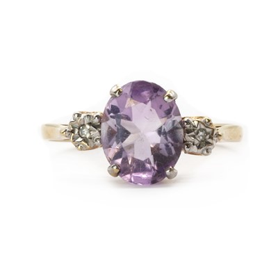 Lot 213 - A 9ct gold amethyst and diamond three stone ring