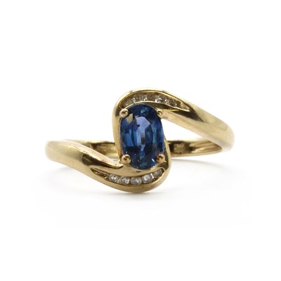 Lot 147 - A 9ct gold sapphire and diamond crossover ring