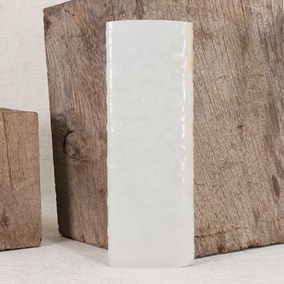 Lot 114 - A Chinese white jade armrest