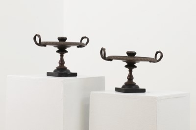Lot 212 - A pair of bronze candlesticks