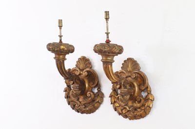 Lot 15 - A pair of carved giltwood wall lights