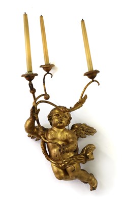 Lot 444 - A giltwood putto wall light