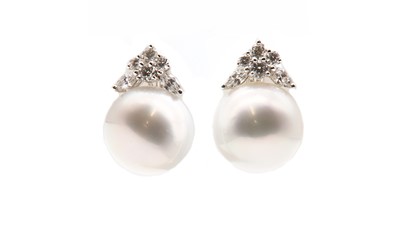 Lot 243 - A pair of cultured South Sea pearl and diamond stud earrings