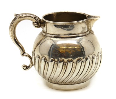 Lot 25 - A George III silver cream jug