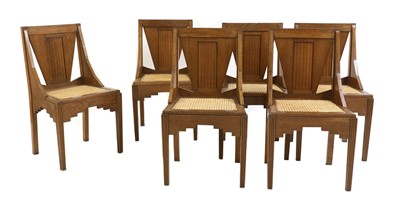 Lot 244 - A set of six oak dining chairs