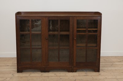 Lot 232 - An Heal's oak and glazed side cabinet or bookcase