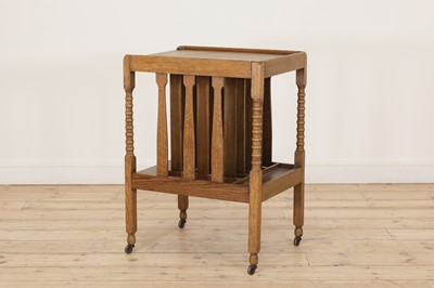 Lot 89 - An Arts and Crafts oak magazine/book trolley