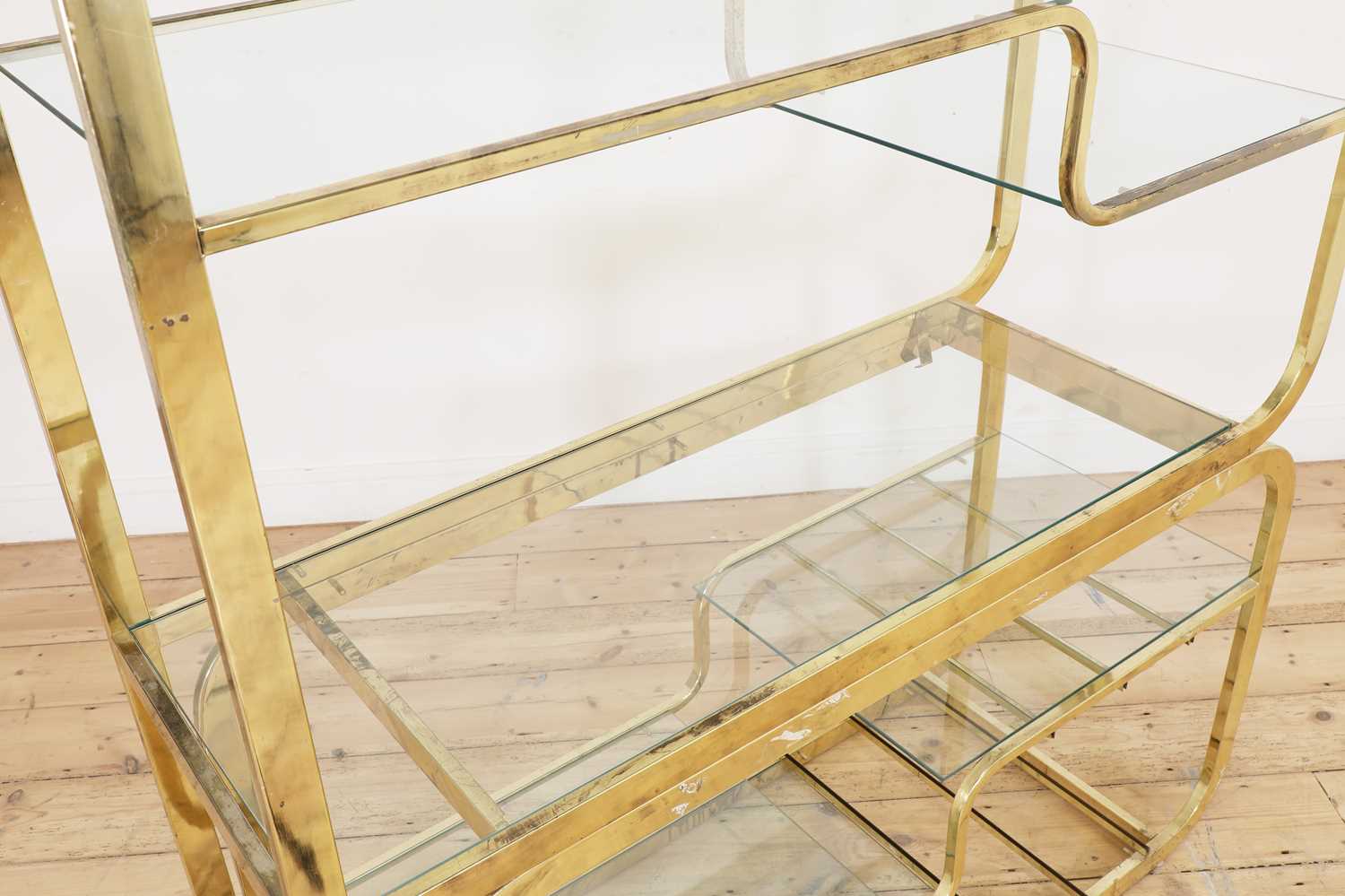 Lot 336 - A brass two-part freestanding wall shelf,