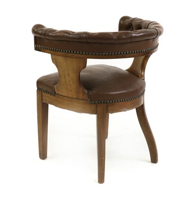 Lot 507 - A walnut and buttoned leather armchair