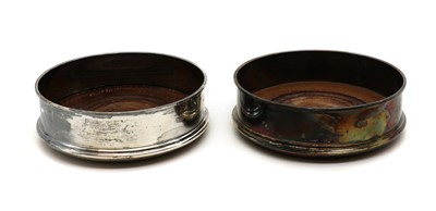Lot 17 - A pair of silver wine coasters